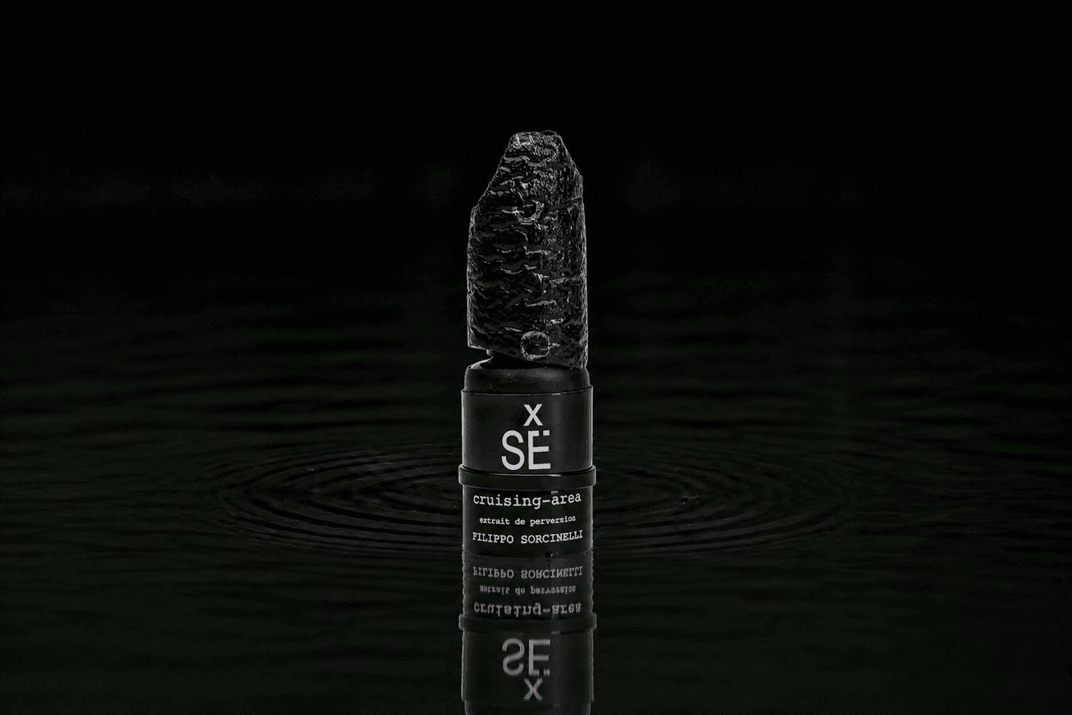 Filippo Sorcinelli Cruising Area fragrance bottle floating above dark water