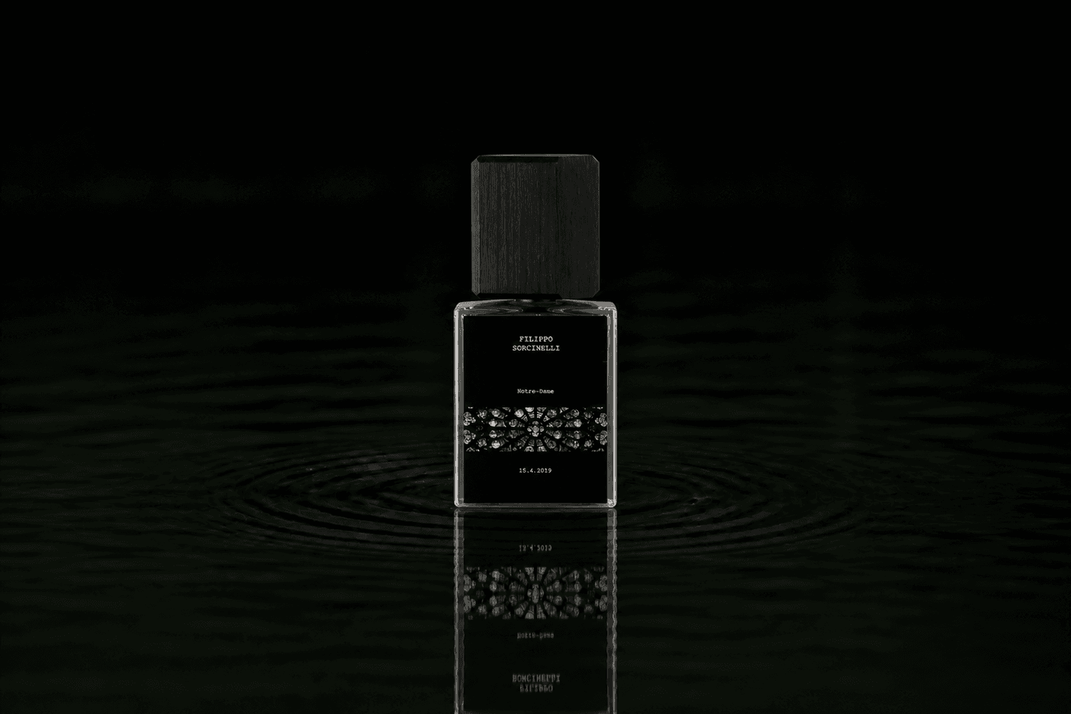 Filippo Sorcinelli Notre Dame 15.4.2019 fragrance bottle floating above dark water