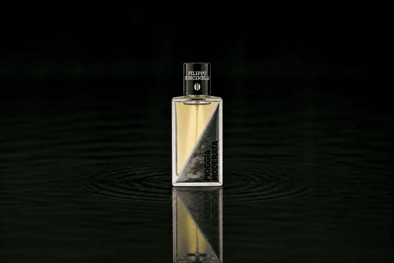 Filippo Sorcinelli Pioggia Moderata fragrance bottle floating above dark water