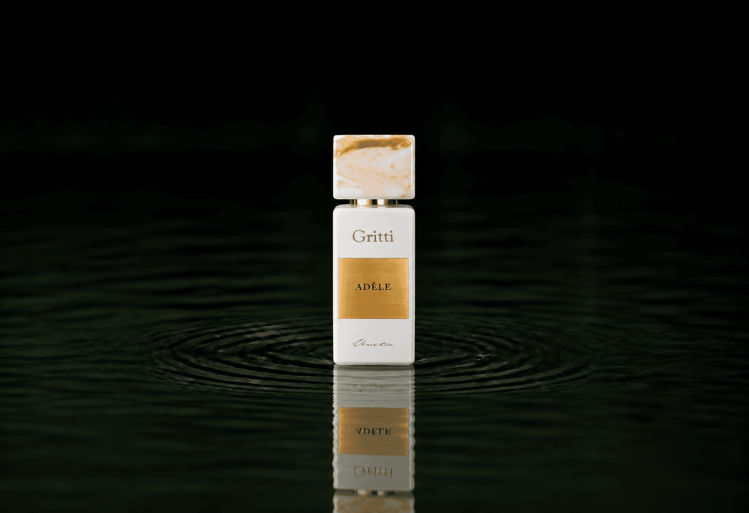 Gritti Adele fragrance bottle floating above dark water