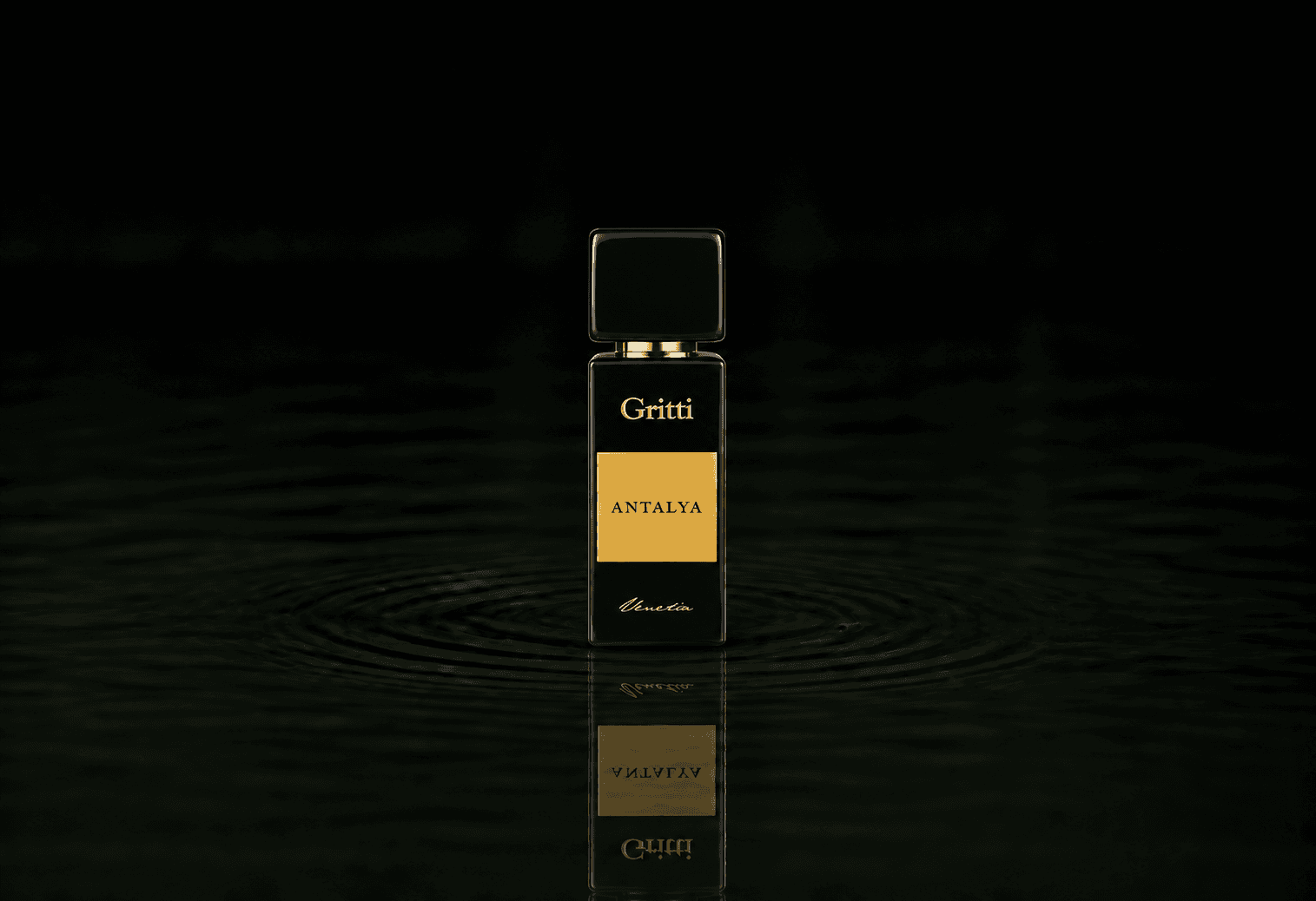 Gritti Antalya fragrance bottle floating above dark water