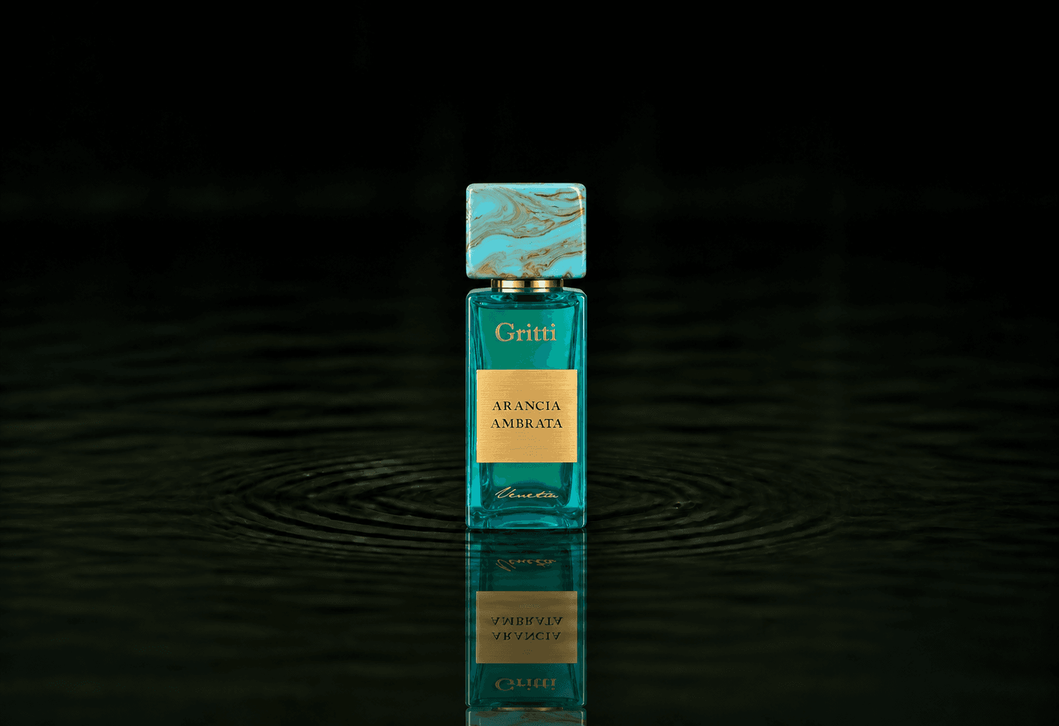 Gritti Arancia Ambrata fragrance bottle floating above dark water