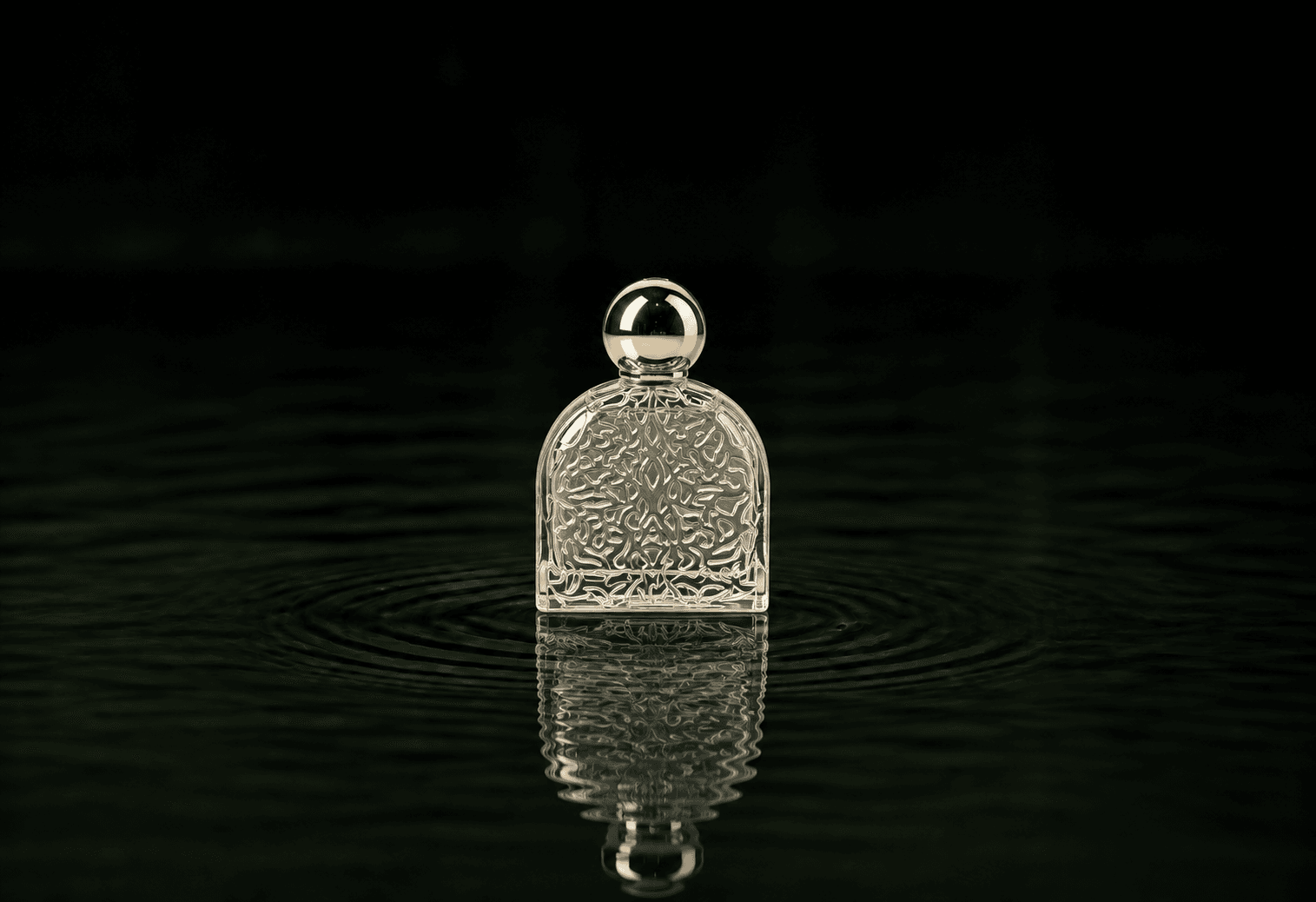 M.Micallef Micallef - Stories of Love Soleil Passion fragrance bottle floating above dark water
