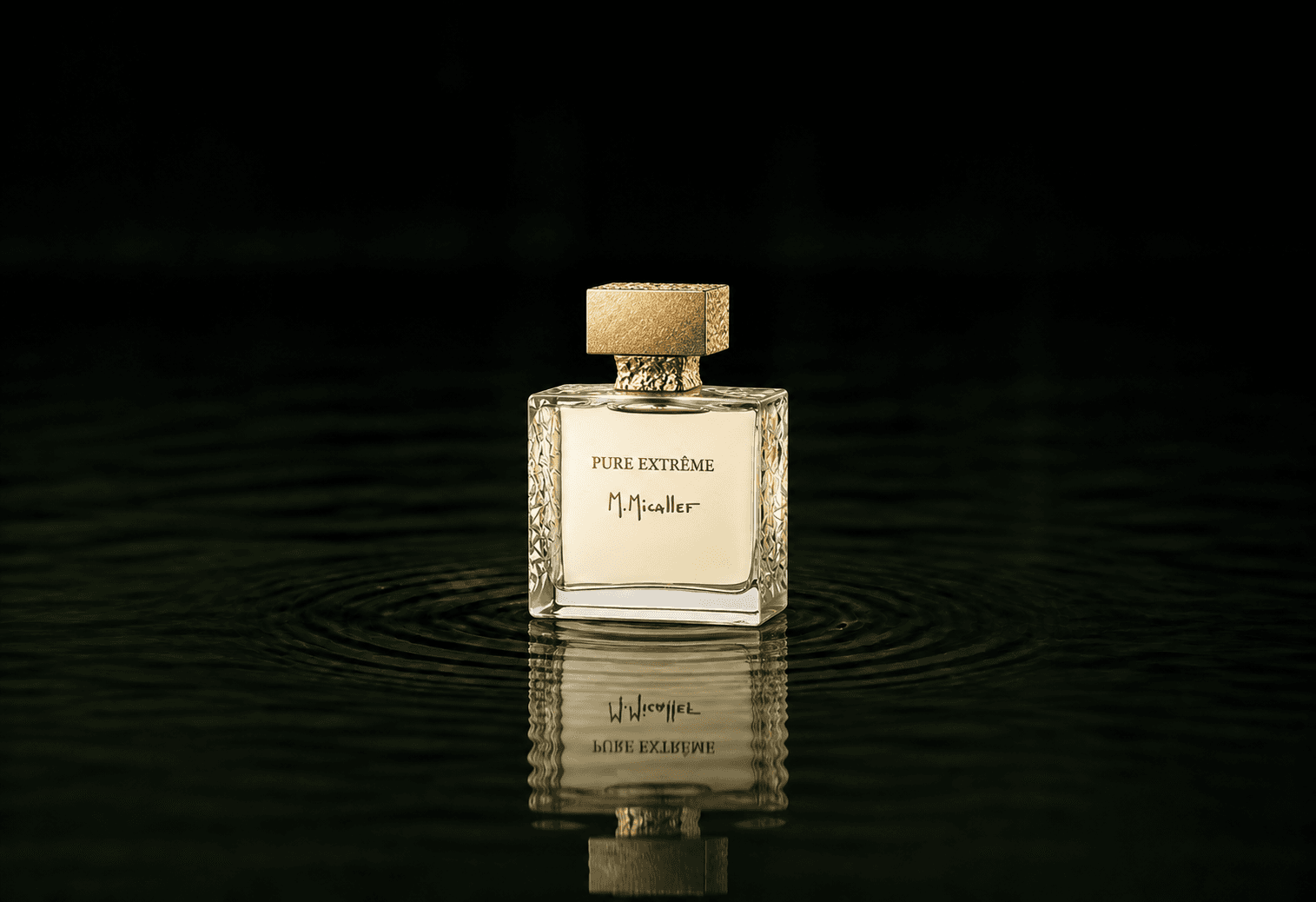 M.Micallef Pure Extreme fragrance bottle floating above dark water