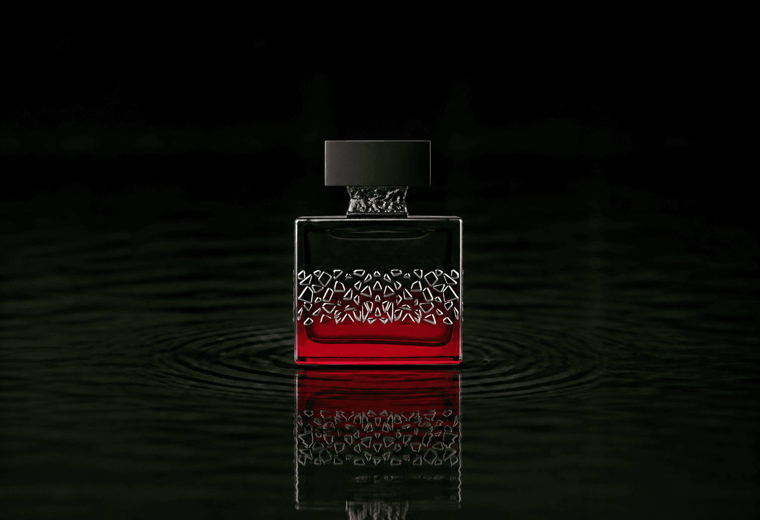 M.Micallef Red Colorado fragrance bottle floating above dark water