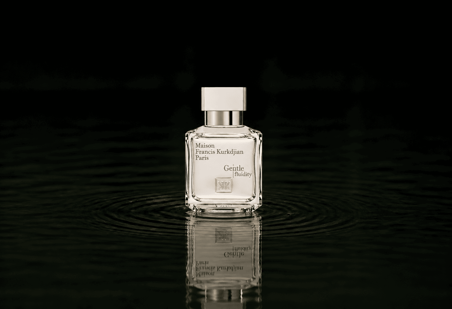 Maison Francis Kurkdjian Gentle Fluidity Silver fragrance bottle floating above dark water