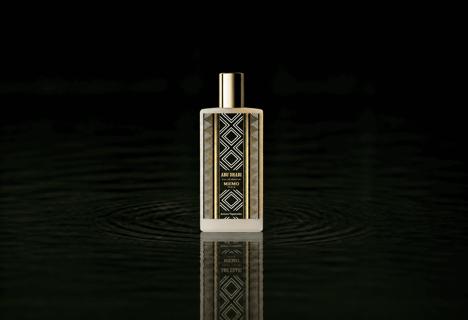 Memo Paris Abu Dhabi fragrance bottle floating above dark water