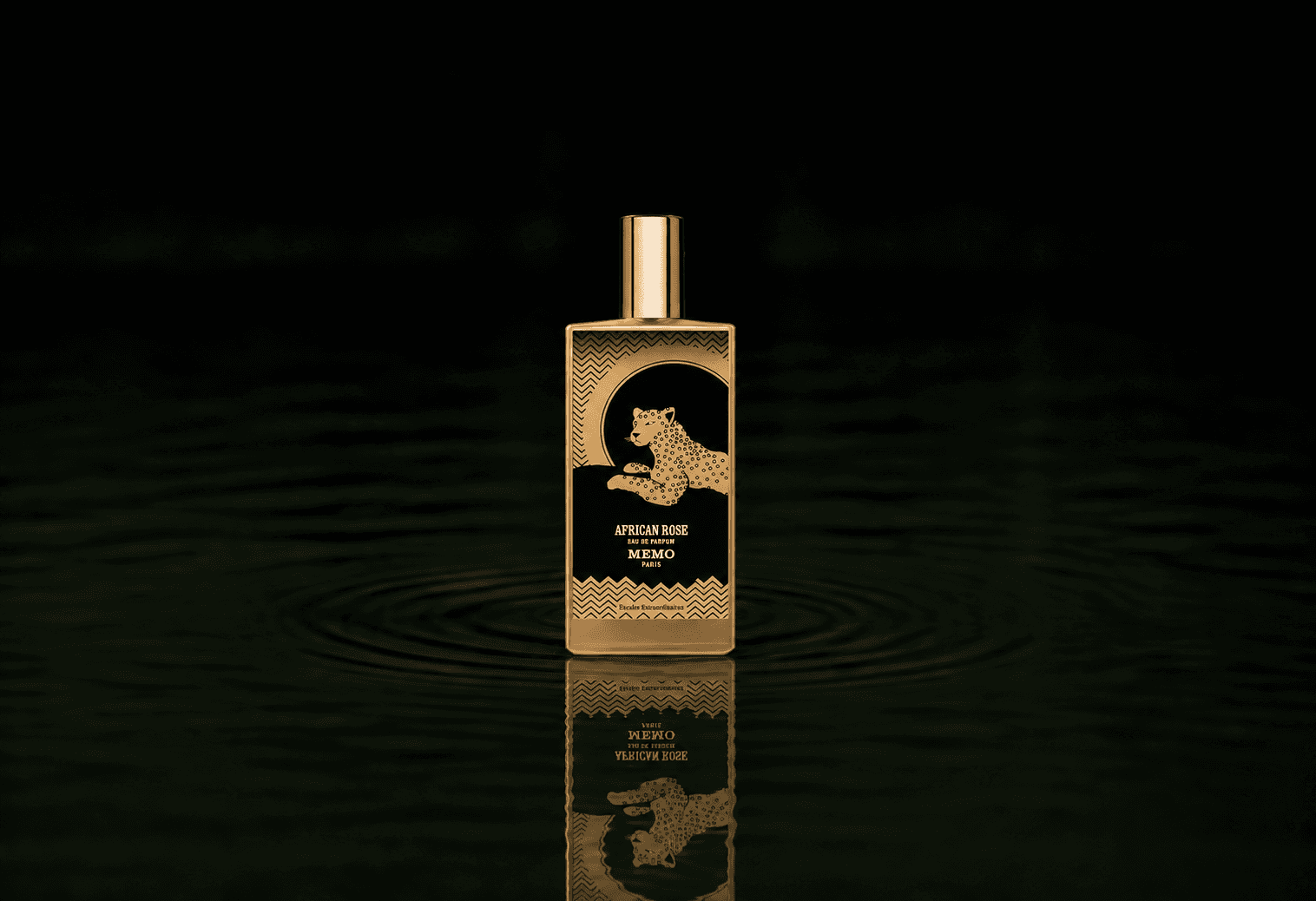 Memo Paris African Rose fragrance bottle floating above dark water